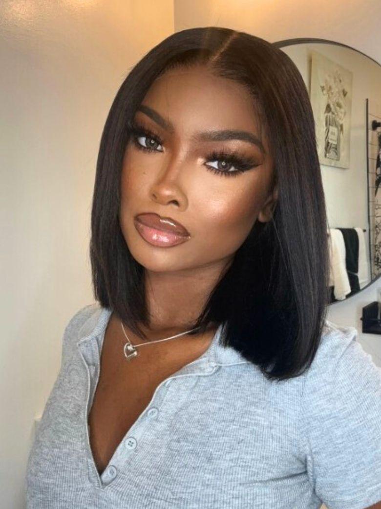 @NauteyaWhyee wearing a sleek UNice yaki straight black human hair bob wig with a precise middle part and natural scalp look.